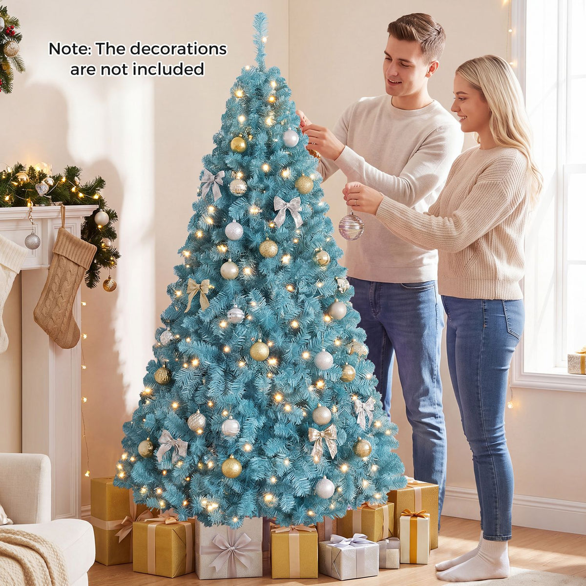 A lit peacock-blue Christmas tree decorated with ornaments as a couple adds more decorations.