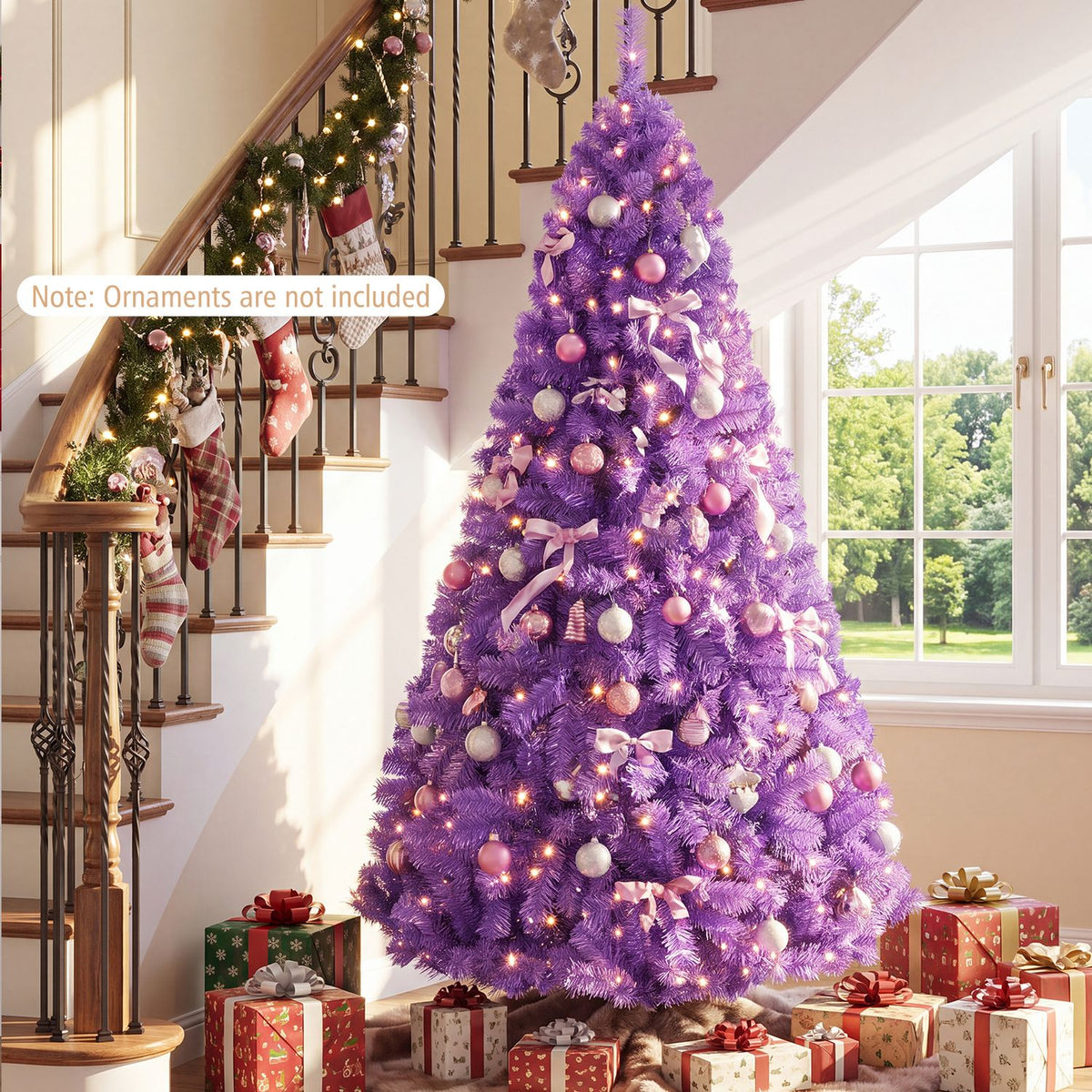 Purple Christmas tree with warm lights, pink and white ornaments, and presents in a bright living room.