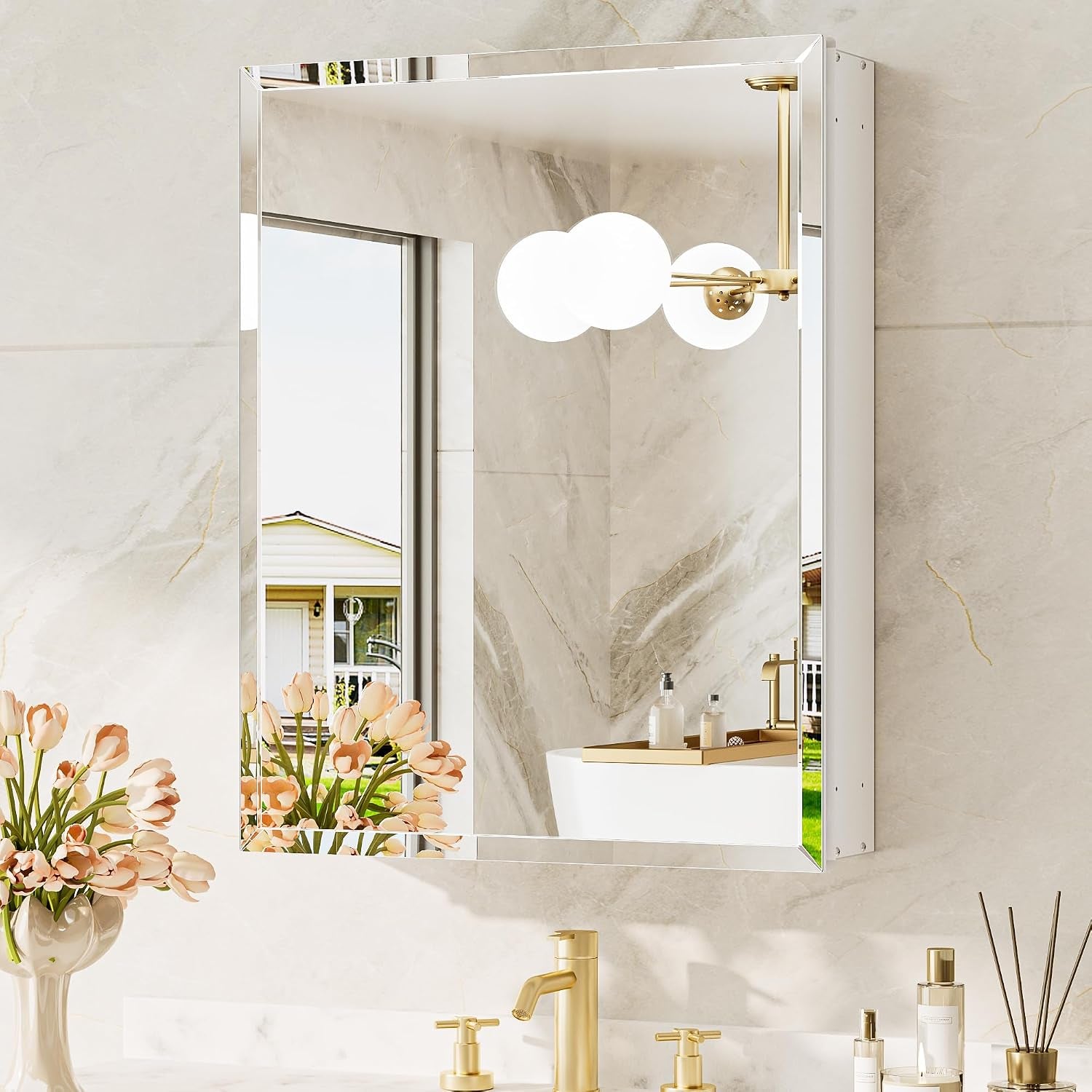Single mirrored cabinet with gold faucet and warm gold light fixture reflected in the bevelled mirror.
