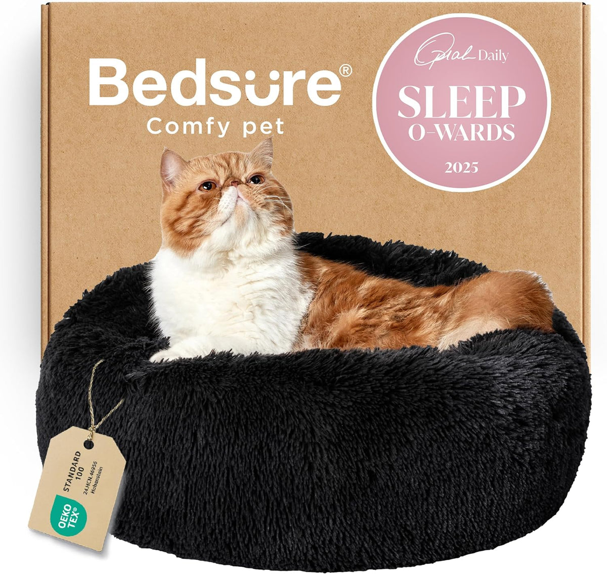 Black round faux-fur donut bed with an orange-and-white cat reclining inside.