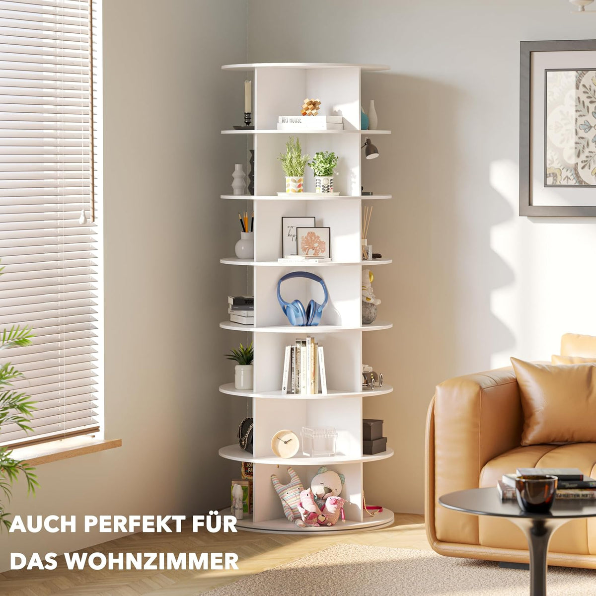 White rotating tower used as shelving in a living room corner with plants, books and decorative items on the shelves