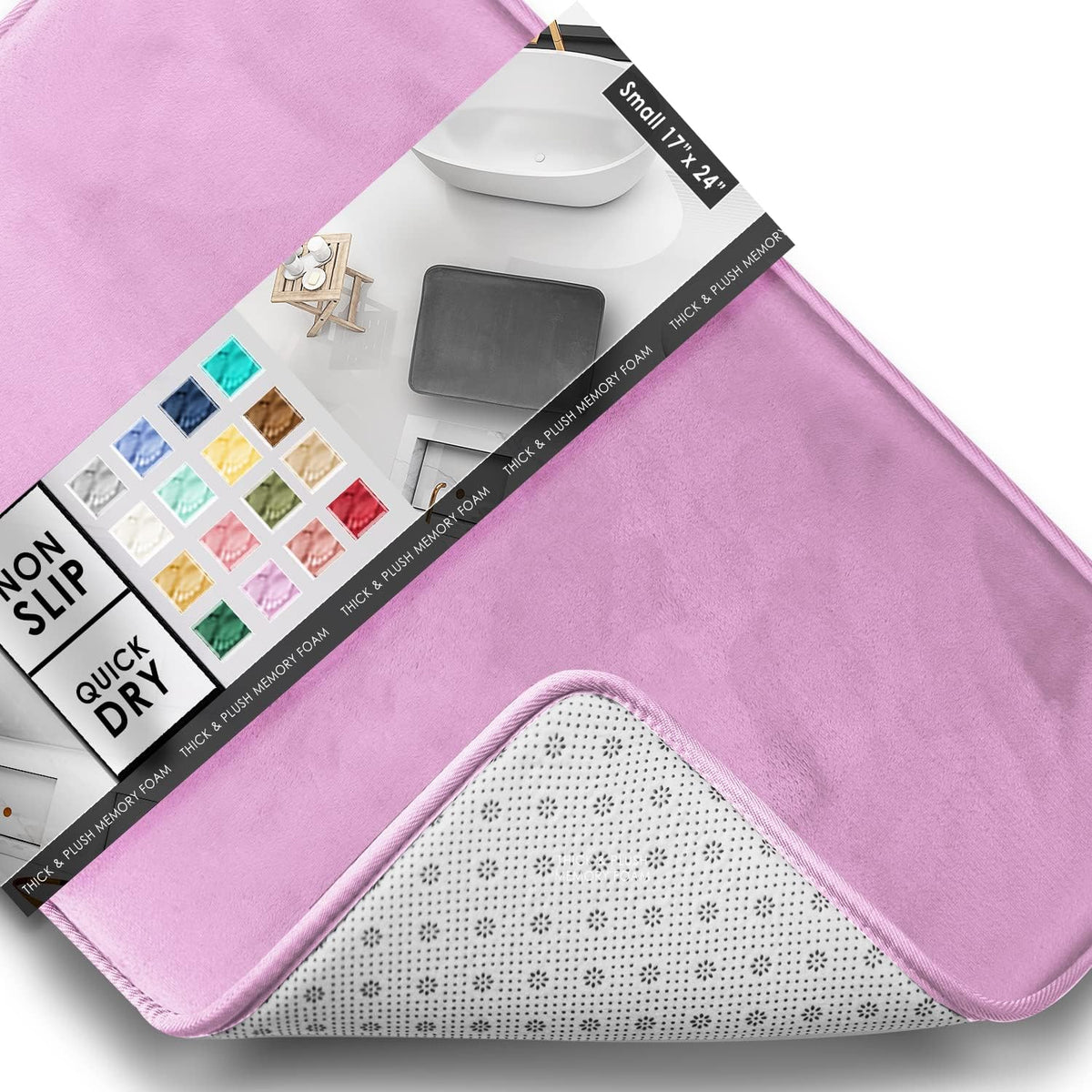 Close-up diagonal view of a pink rectangular rug showing plush top, packaging, and a peeled corner revealing dotted backing