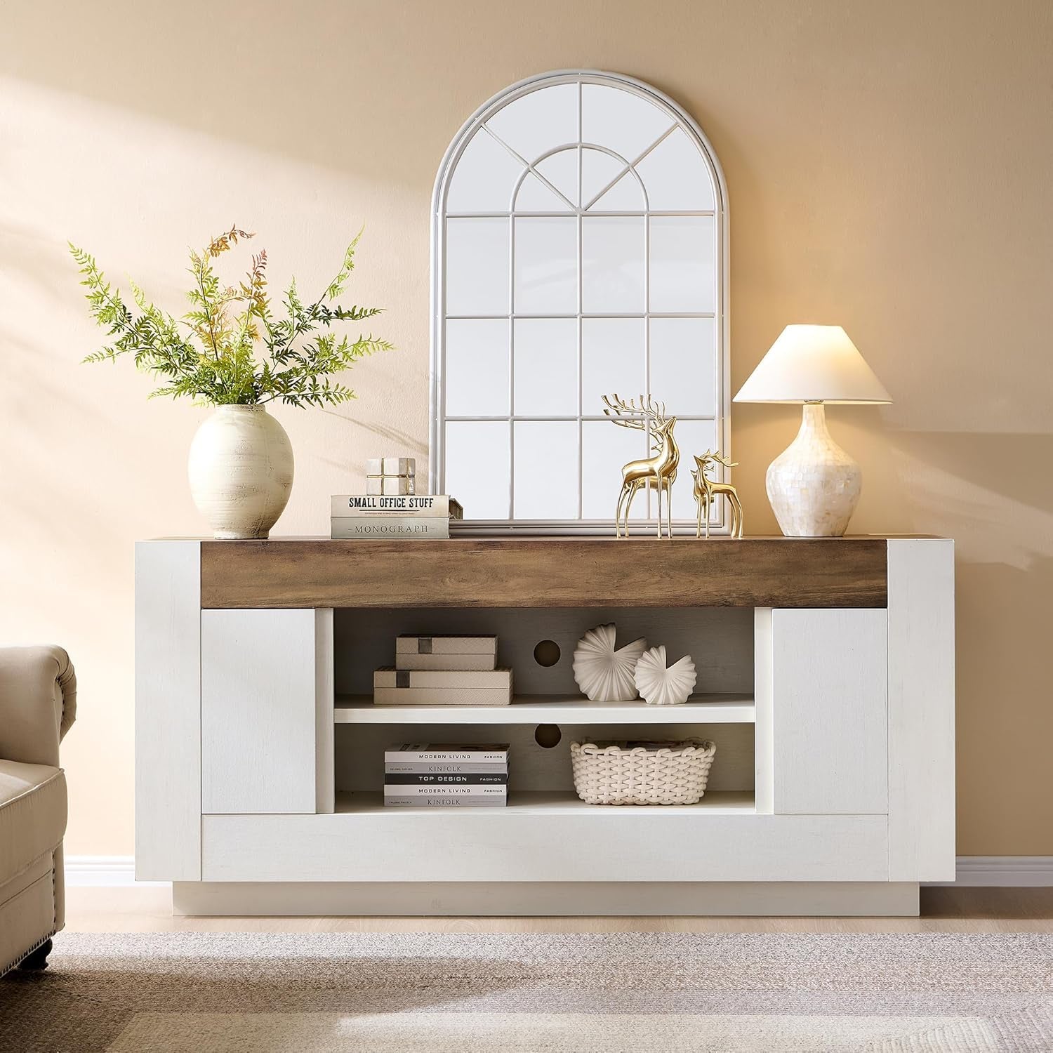 Antique white TV stand with rustic wood top, centered front view styled with mirror and decorative accessories