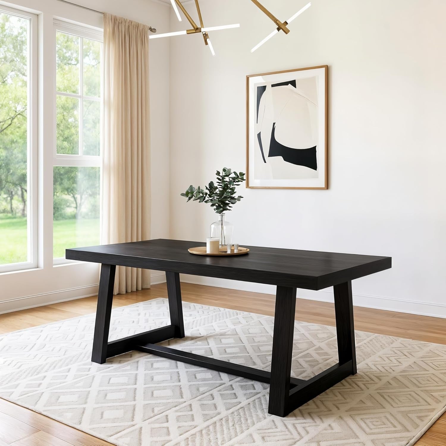 Dark black-finish rectangular dining table on patterned rug with vase centerpiece