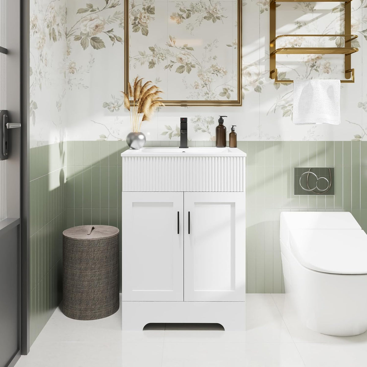White single-sink vanity front with fluted upper drawer panel and black handles in a small bathroom