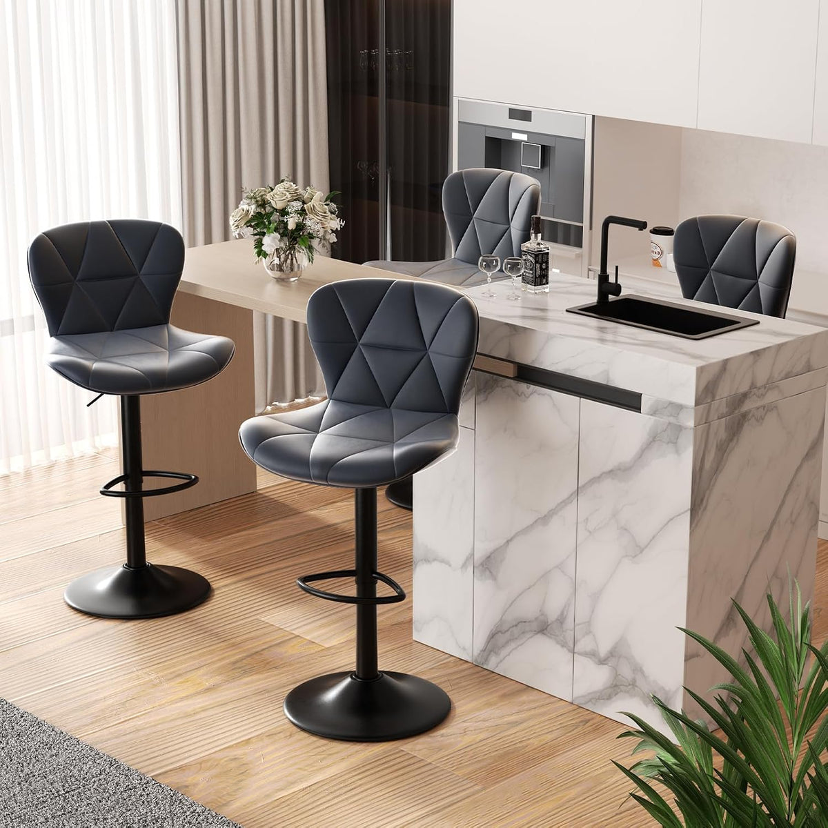 Three swivel bar stools around a light-wood peninsula, one stool pulled slightly forward near a vase of flowers.