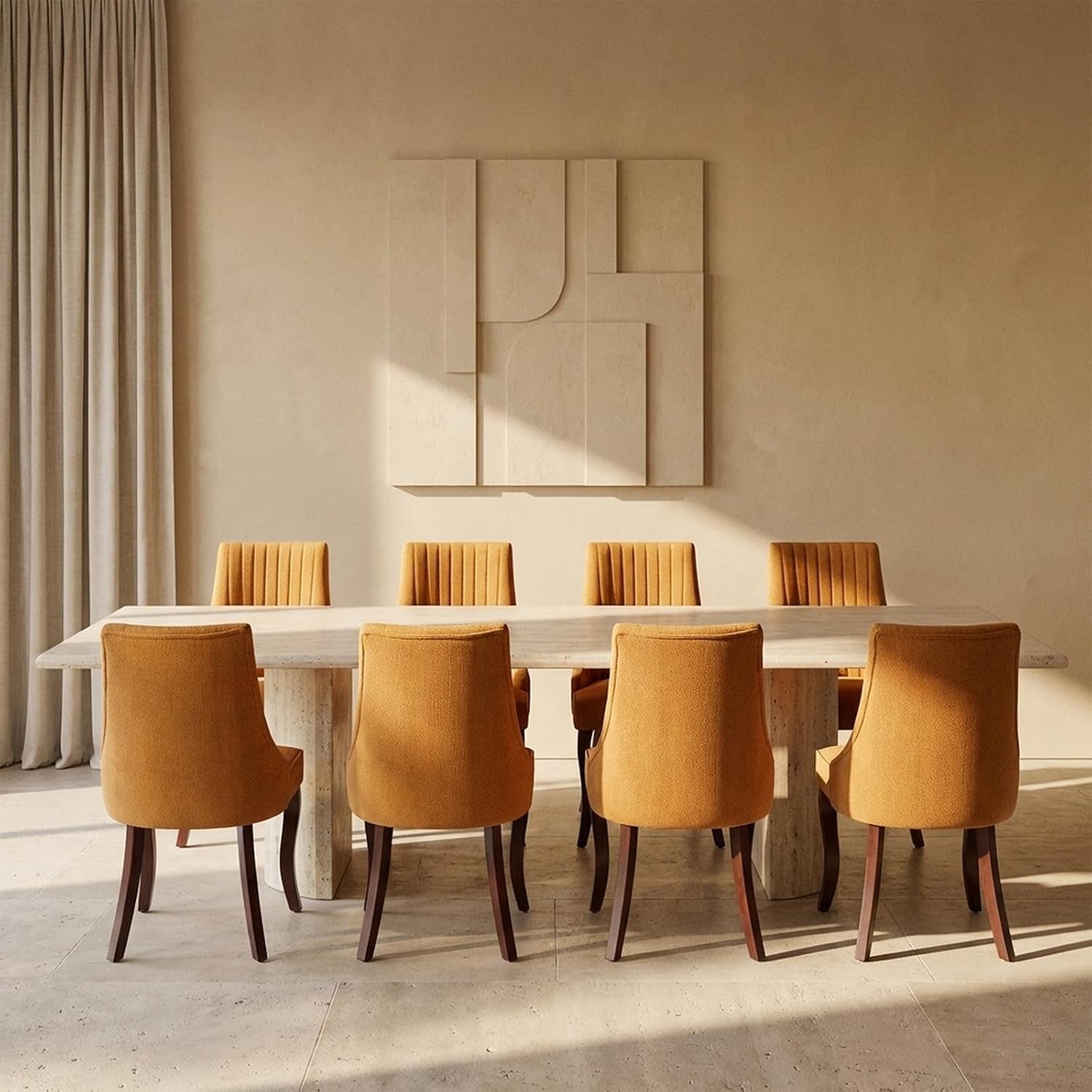 Eight mustard-orange upholstered dining chairs shown from the rear around a long stone table in warm light.