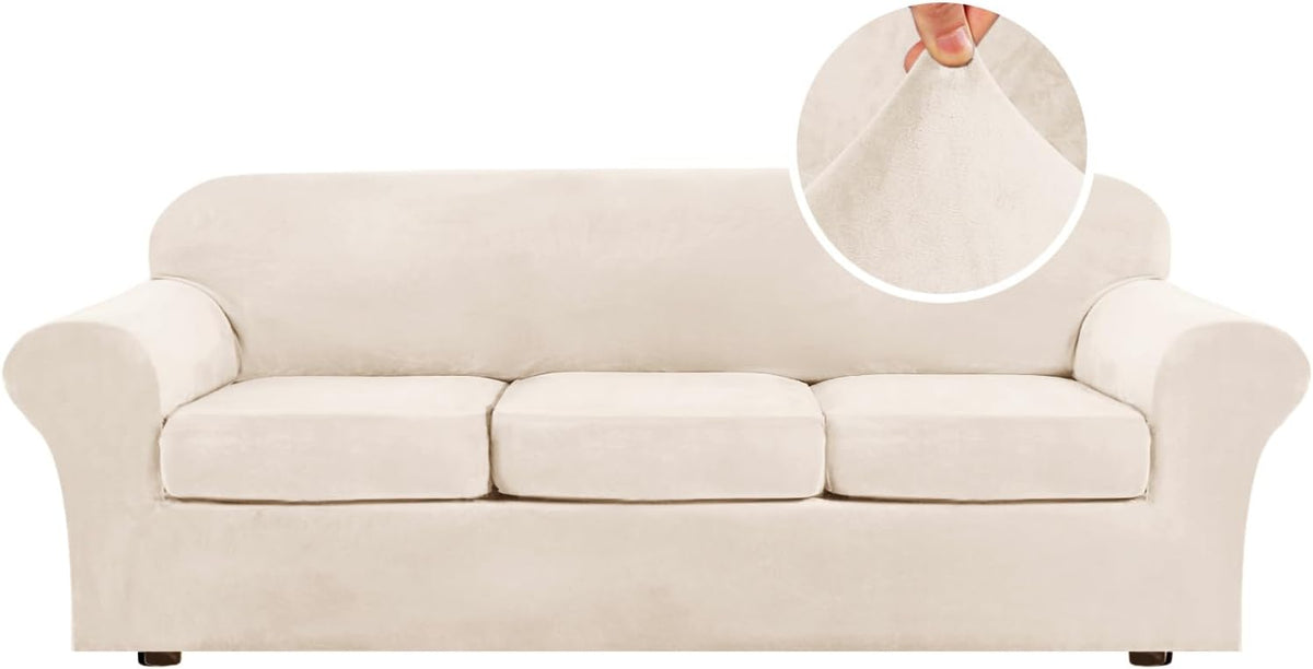 Pale cream three-cushion sofa on white background, rounded arms and low dark wooden feet visible.