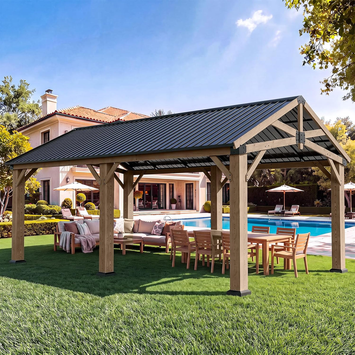 Daytime wide view of a wooden gable gazebo covering a dining table and L-shaped sofa beside a pool