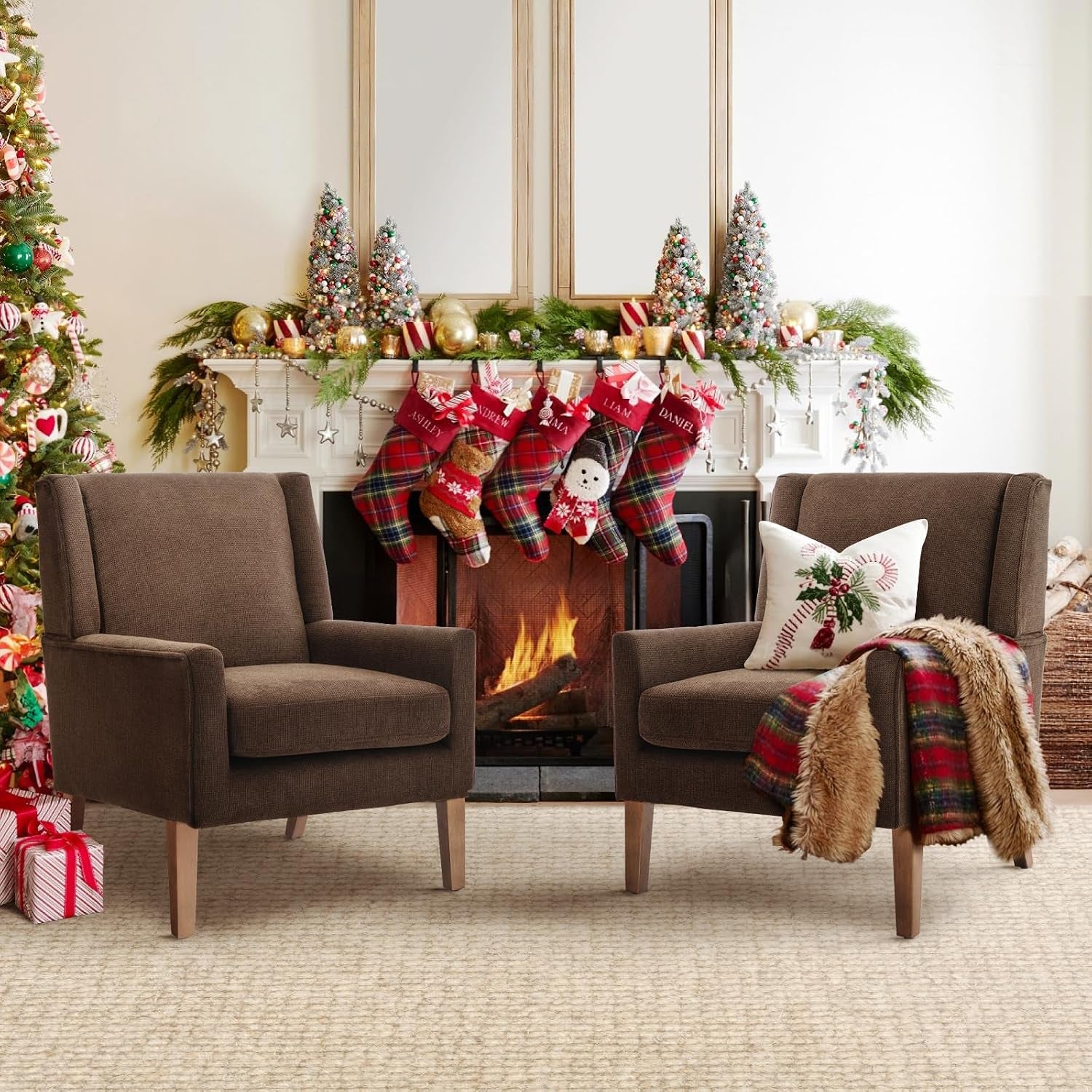 Pair of brown chenille wingback chairs flanking a decorated fireplace in a holiday living room