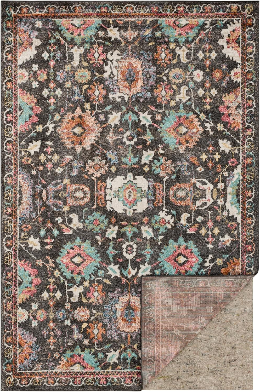 Ornate multicolor area rug laid flat, with its lower-right corner turned up to show the neutral felt pad beneath.