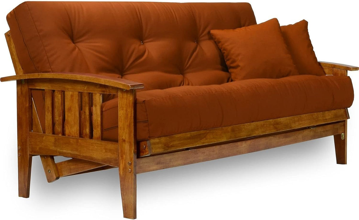 Rust cushion on solid wood futon frame close-up angled view showing curved wooden arm and slatted side
