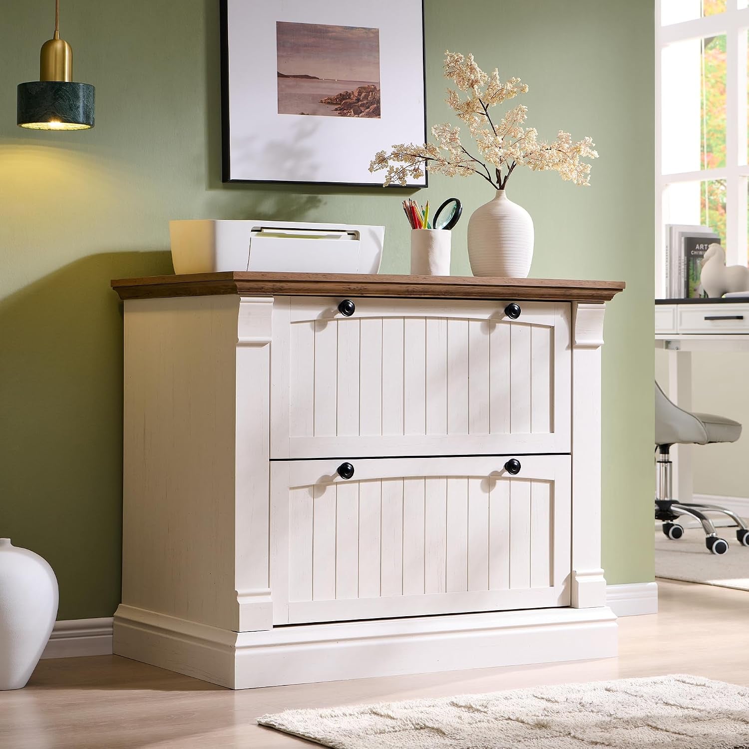 Antique white farmhouse lateral file cabinet with faux wood top, angled front view in a home office