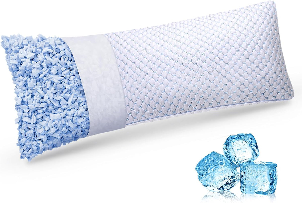 Long pillow laid flat with one open end revealing blue shredded foam and three ice cubes arranged beside it.