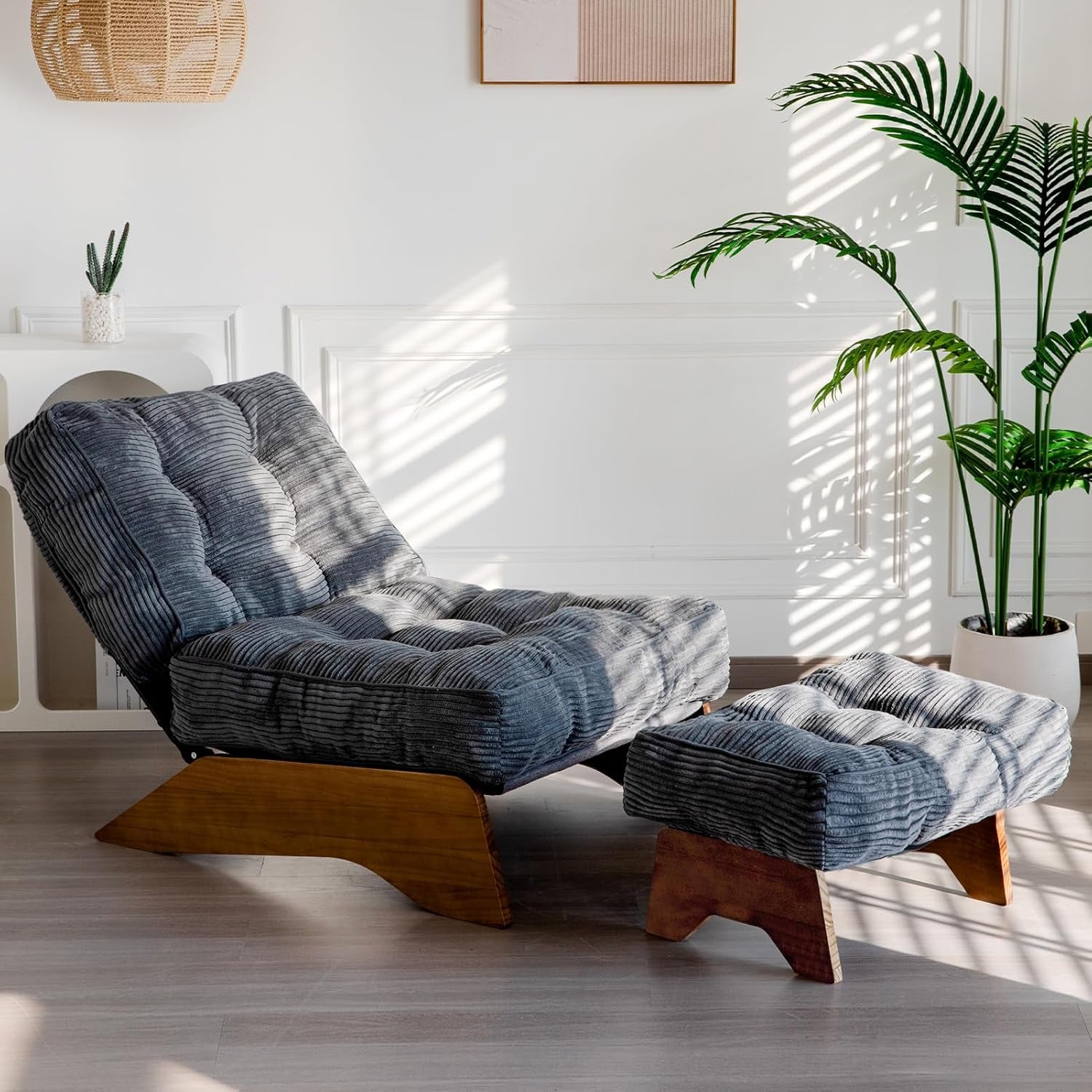 Gray corded fabric adjustable-back lounge chair with matching ottoman on wooden legs.