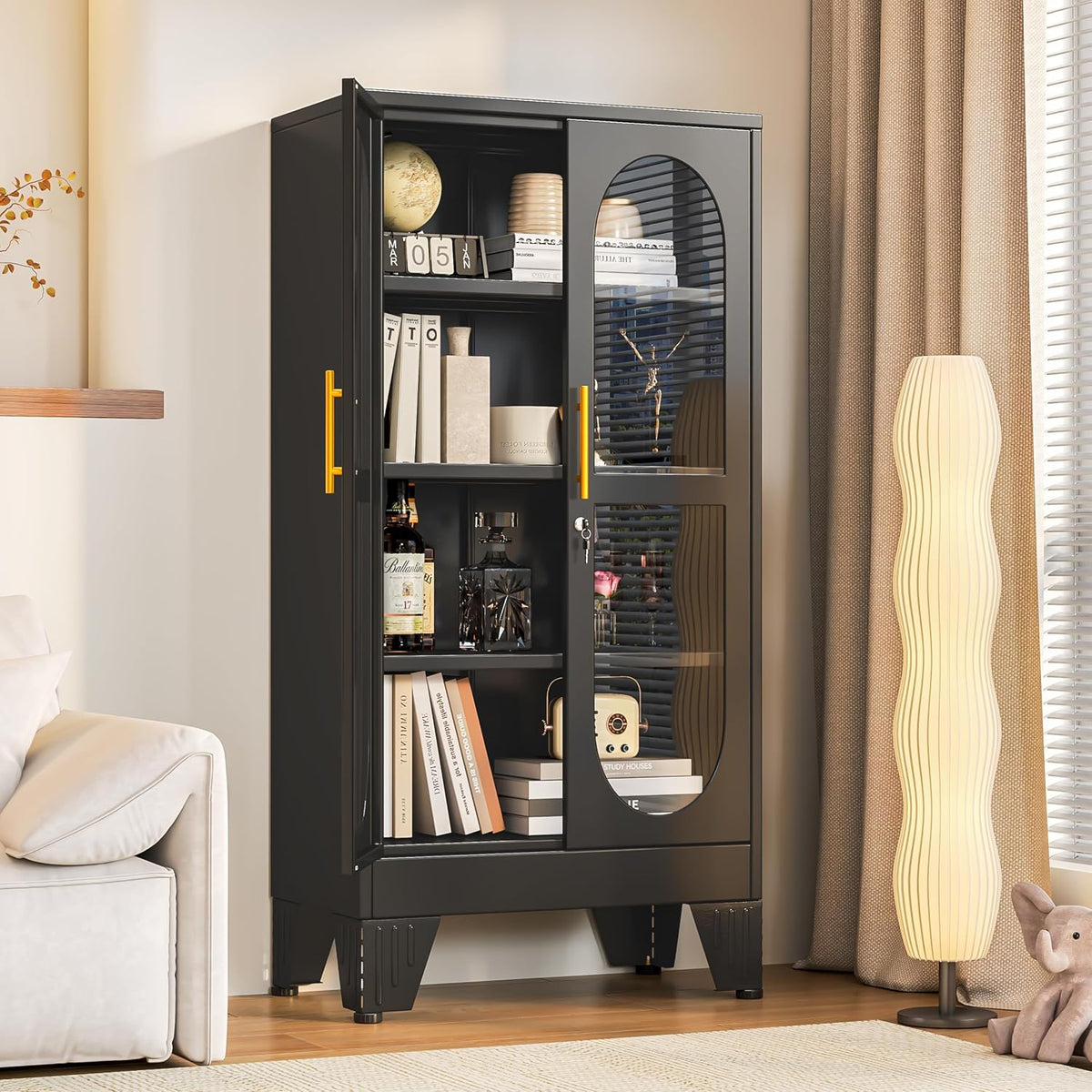 Single black cabinet staged in a living room next to a tall lamp and sofa, door ajar showing items