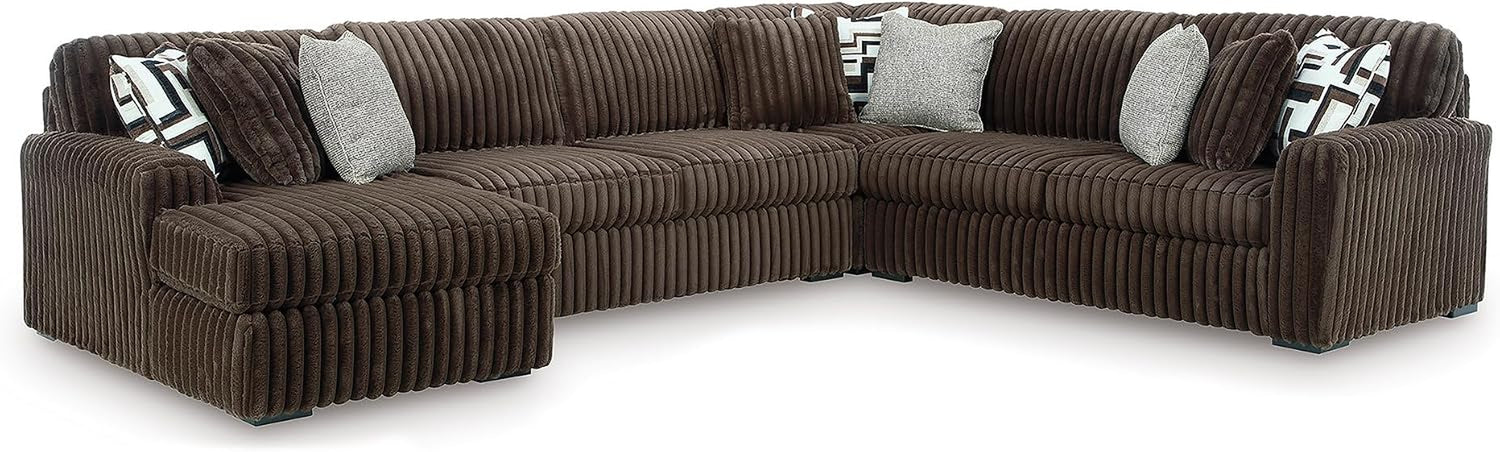 Wide corner view of an oversized chocolate brown corduroy sectional with loose back cushions