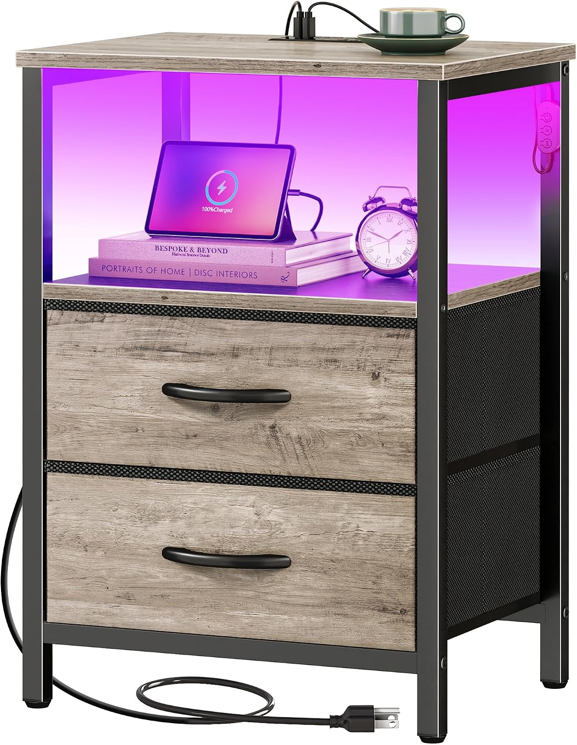 Nightstand with light-weathered wood drawers, open shelf lit purple, top outlet and cord coiled at base.