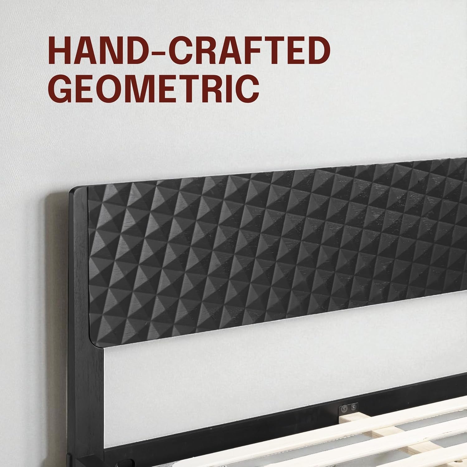 Close-up detail of the hand-crafted 3D geometric carved headboard in a burnt black finish