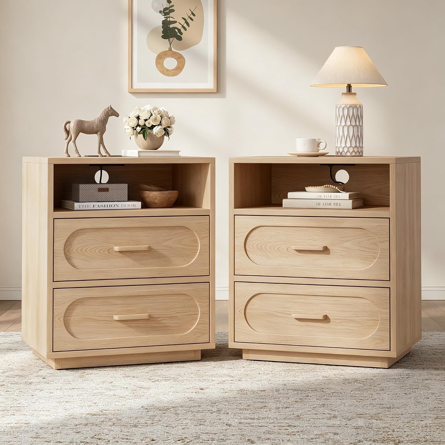 Two matching light oak nightstands side by side, each with open shelf and two drawers, decorative items on top