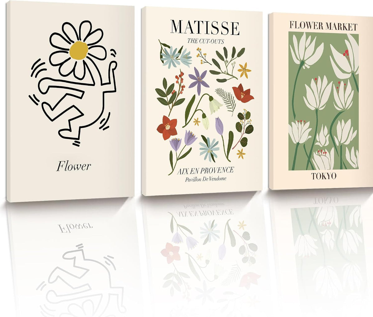 Three unframed canvases displayed side-by-side with simple floral and botanical illustrations in muted greens and pastels.