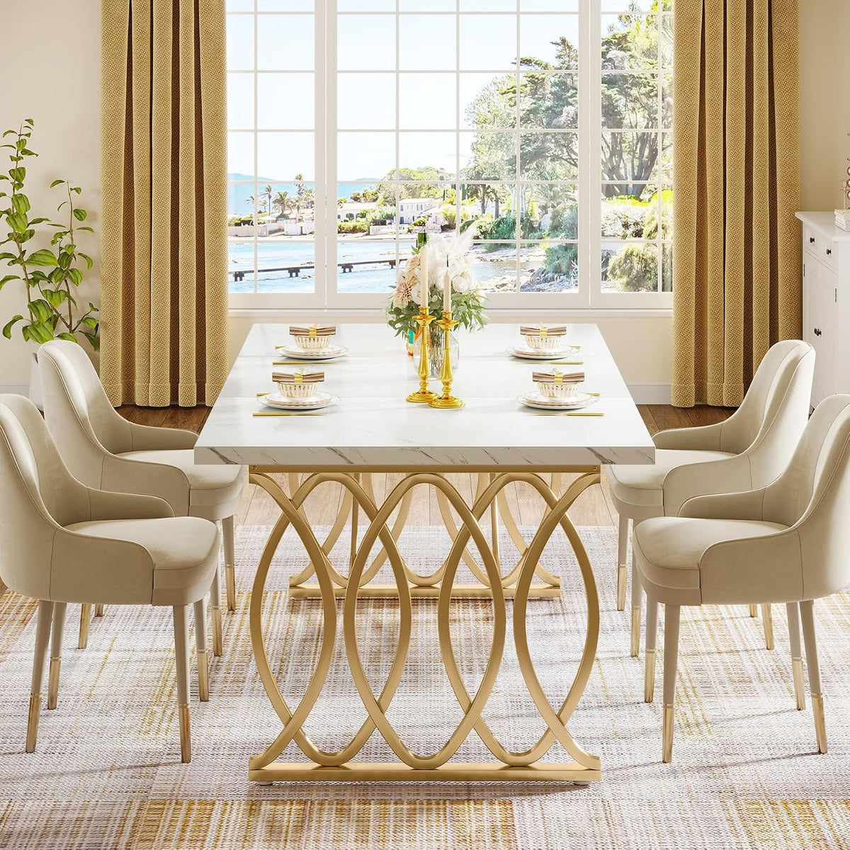 Front view highlighting the gold circular-motif steel legs and white faux marble top of the 63" dining table