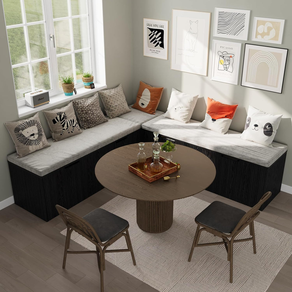 Angled top view of the L-shaped bench in a dining nook with grey cushions and a round table in front