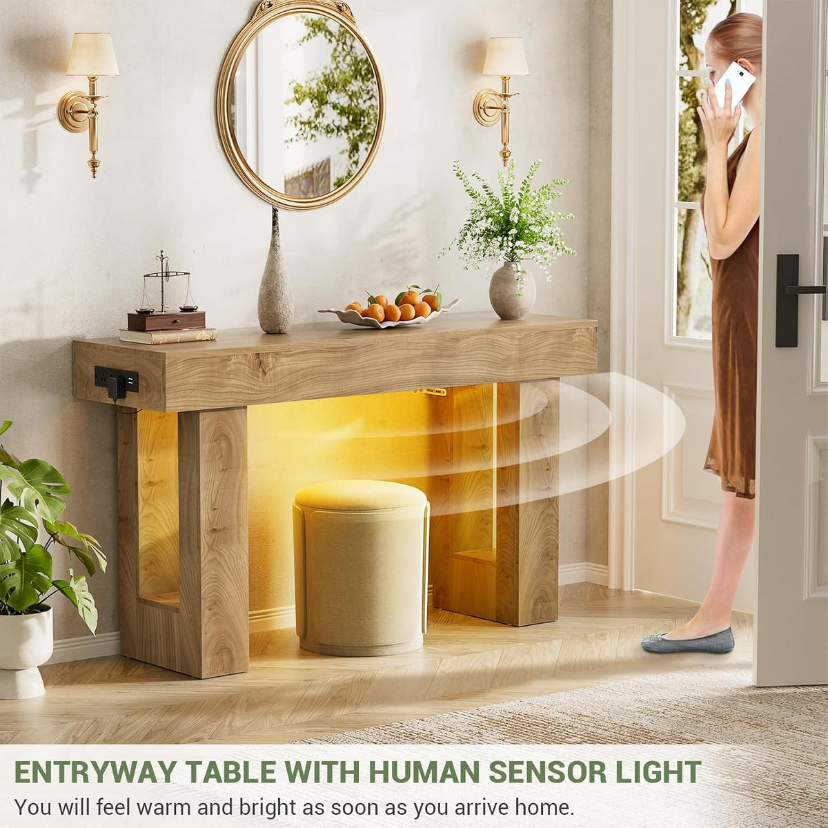 Entryway scene showing console table lit by motion-activated warm light as a person approaches the doorway