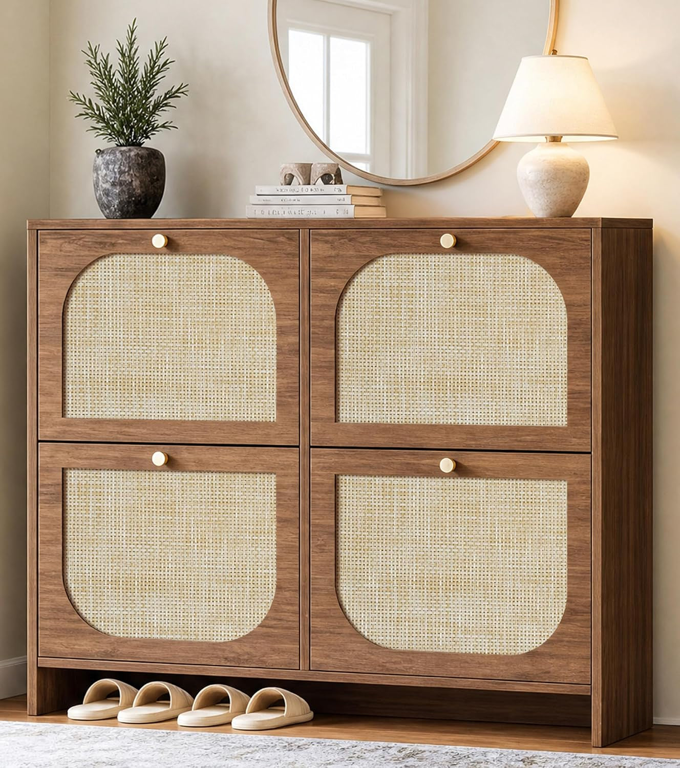 Front view of the rattan-front shoe cabinet with decorative mirror, lamp and slippers at base.
