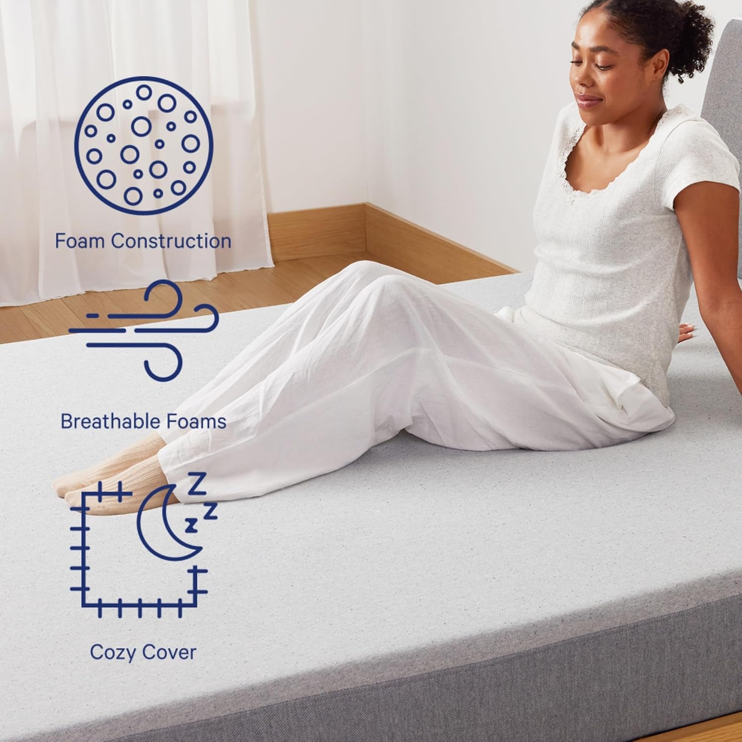 Woman sitting on the mattress surface illustrating breathable foam and cozy cover texture.
