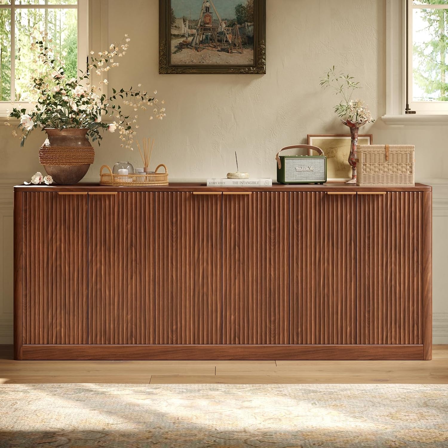 Straight front view of walnut fluted six-door sideboard with decorative items on top