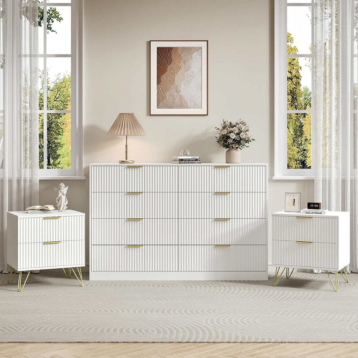 Bright bedroom scene with white seven-drawer dresser centered between two matching two-drawer nightstands.