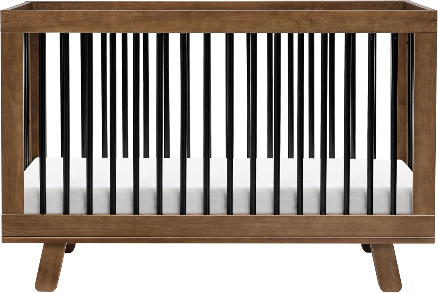 Front-facing crib with dark wood frame and black vertical slats on white mattress.