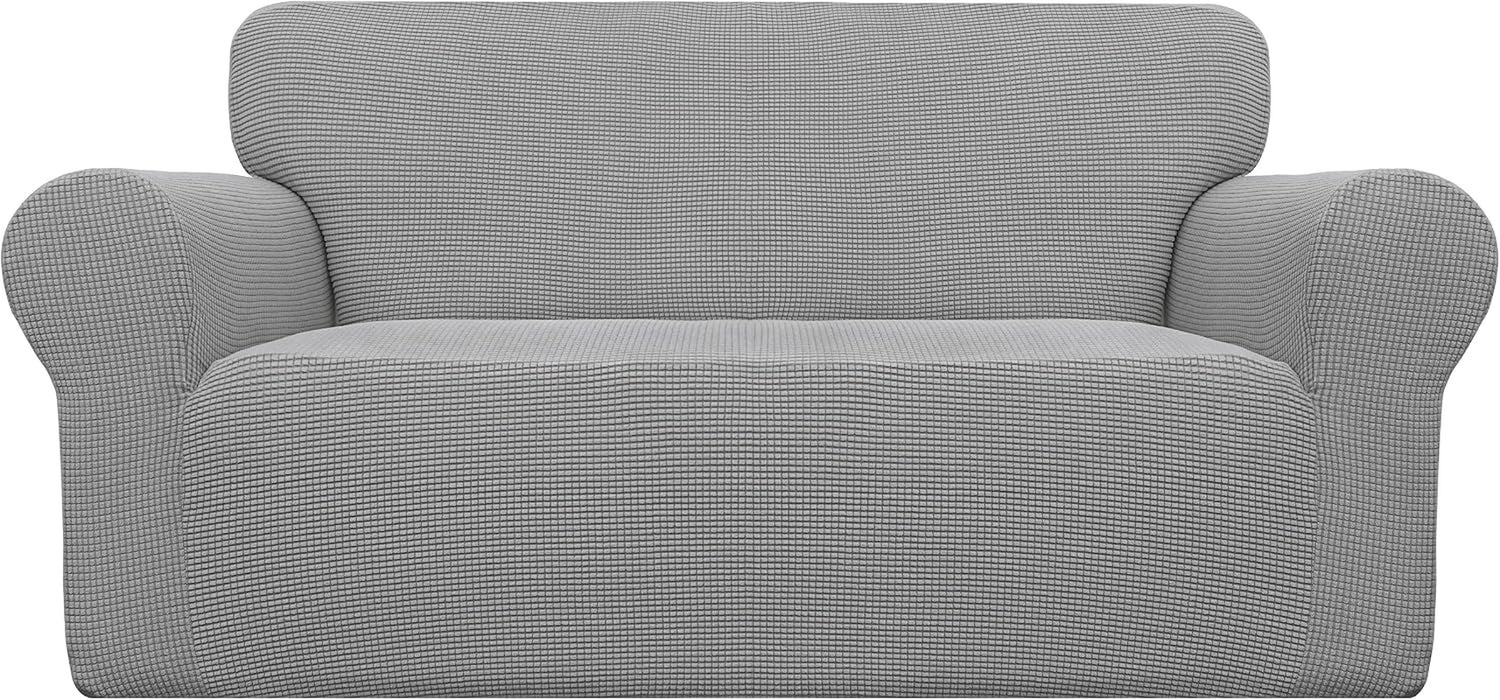 Front view of a two-cushion loveseat covered in a textured light gray stretch slipcover.