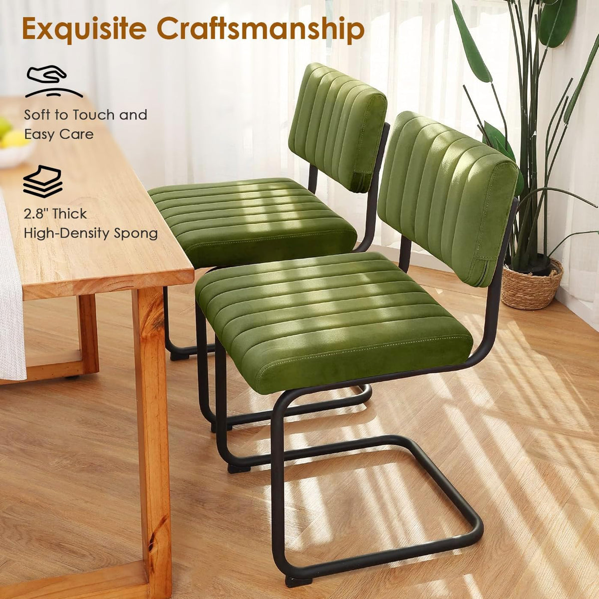 Two green velvet chairs at a wood dining table in a sunlit room, angled rear and side views