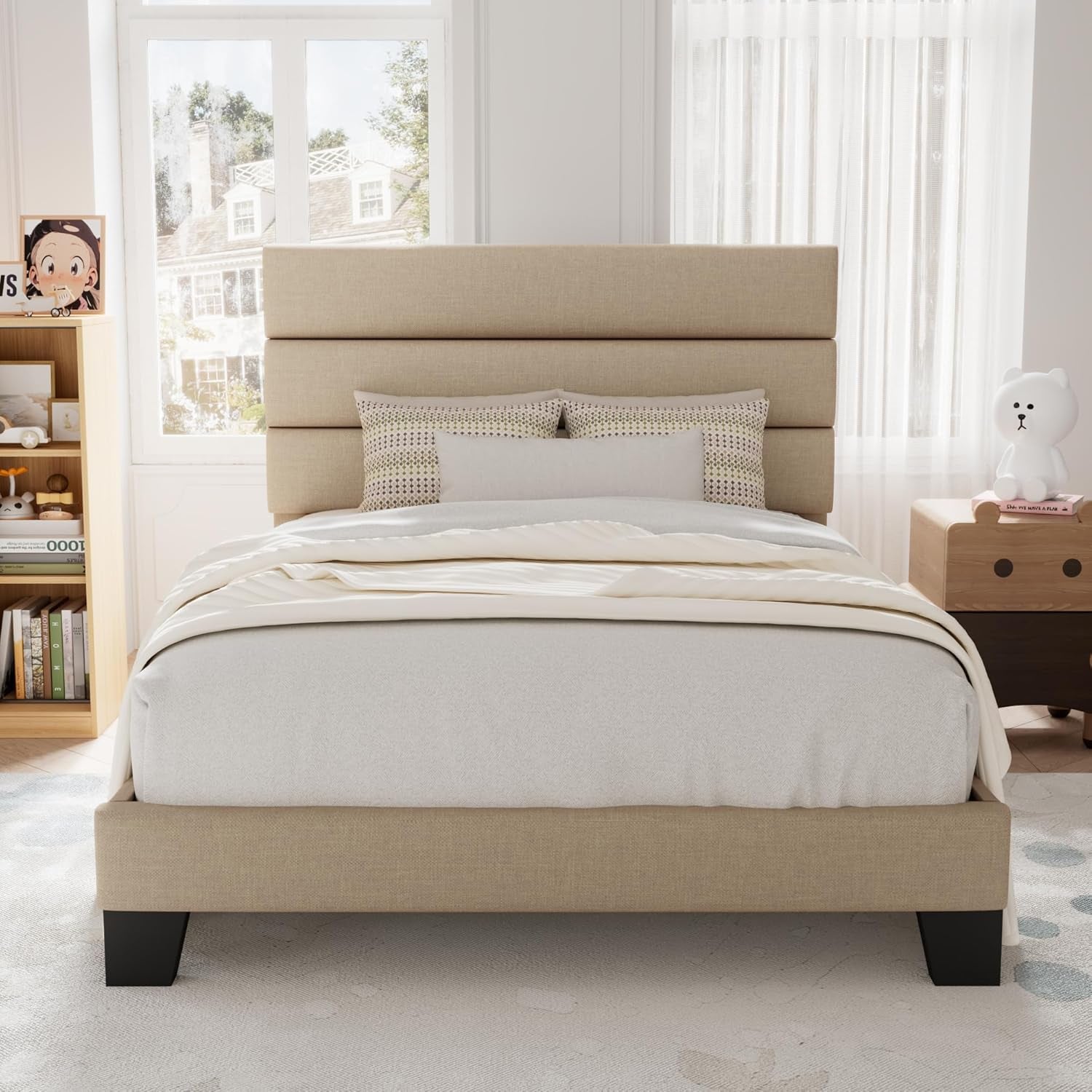 Front children's room view of a beige upholstered bed between a bookcase and bear-shaped nightstand.