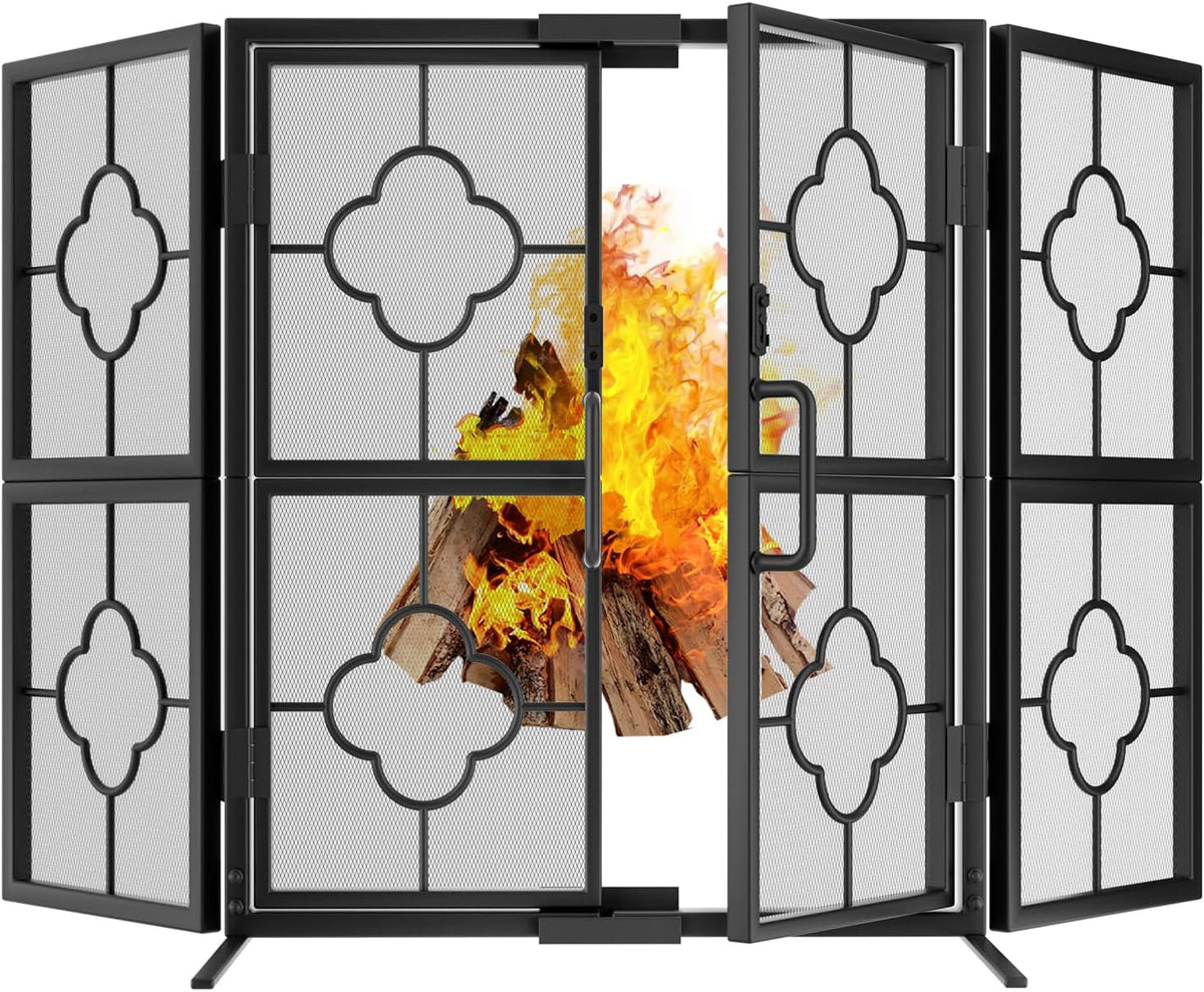 Black four-panel foldable fireplace screen with decorative quatrefoil panels in front of a burning fire.