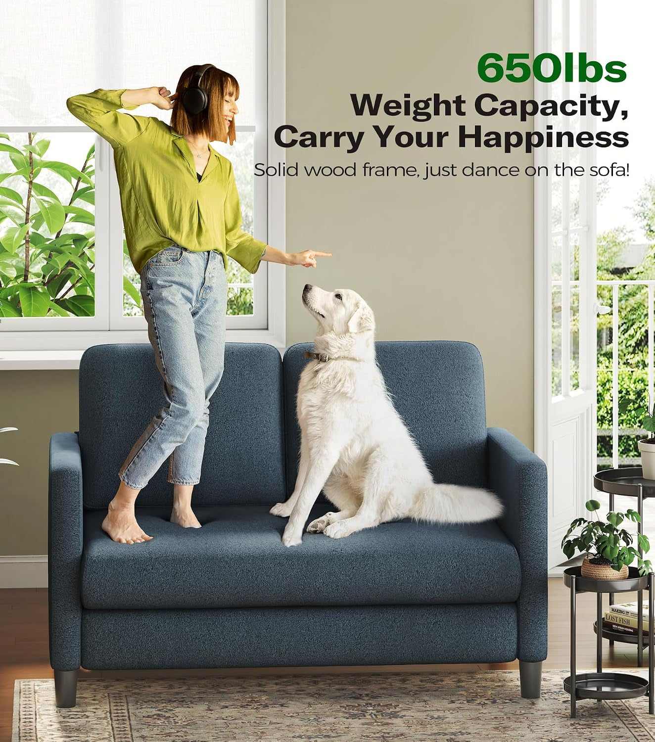 Grey Teddy fabric loveseat with a person and a dog on the seat and text highlighting a 650 lbs capacity