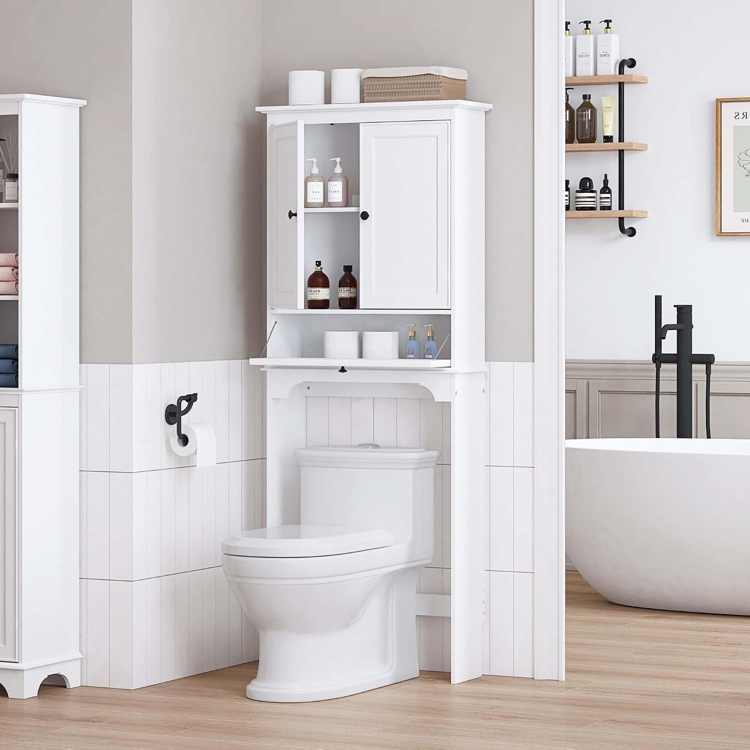 White over-the-toilet cabinet staged above a toilet showing the open tilt-out compartment and storage on the shelf