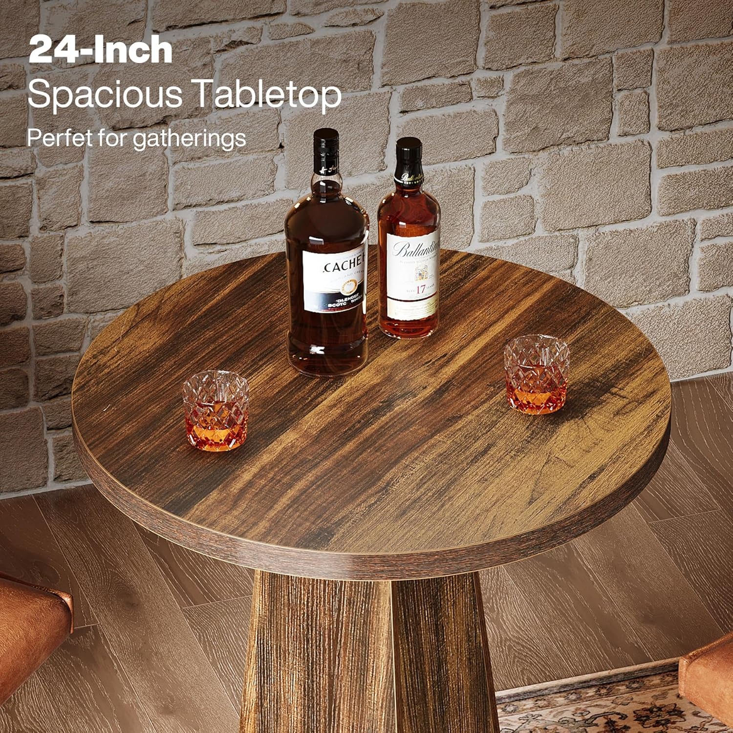 Rustic brown round bar table with tapered base and black metal footrest in a formal entryway setting with two stools