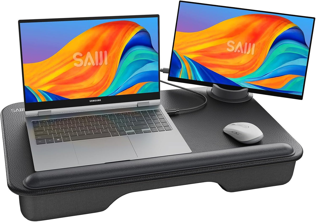 Black lap desk with laptop and side monitor on a plain white background, wrist rest visible