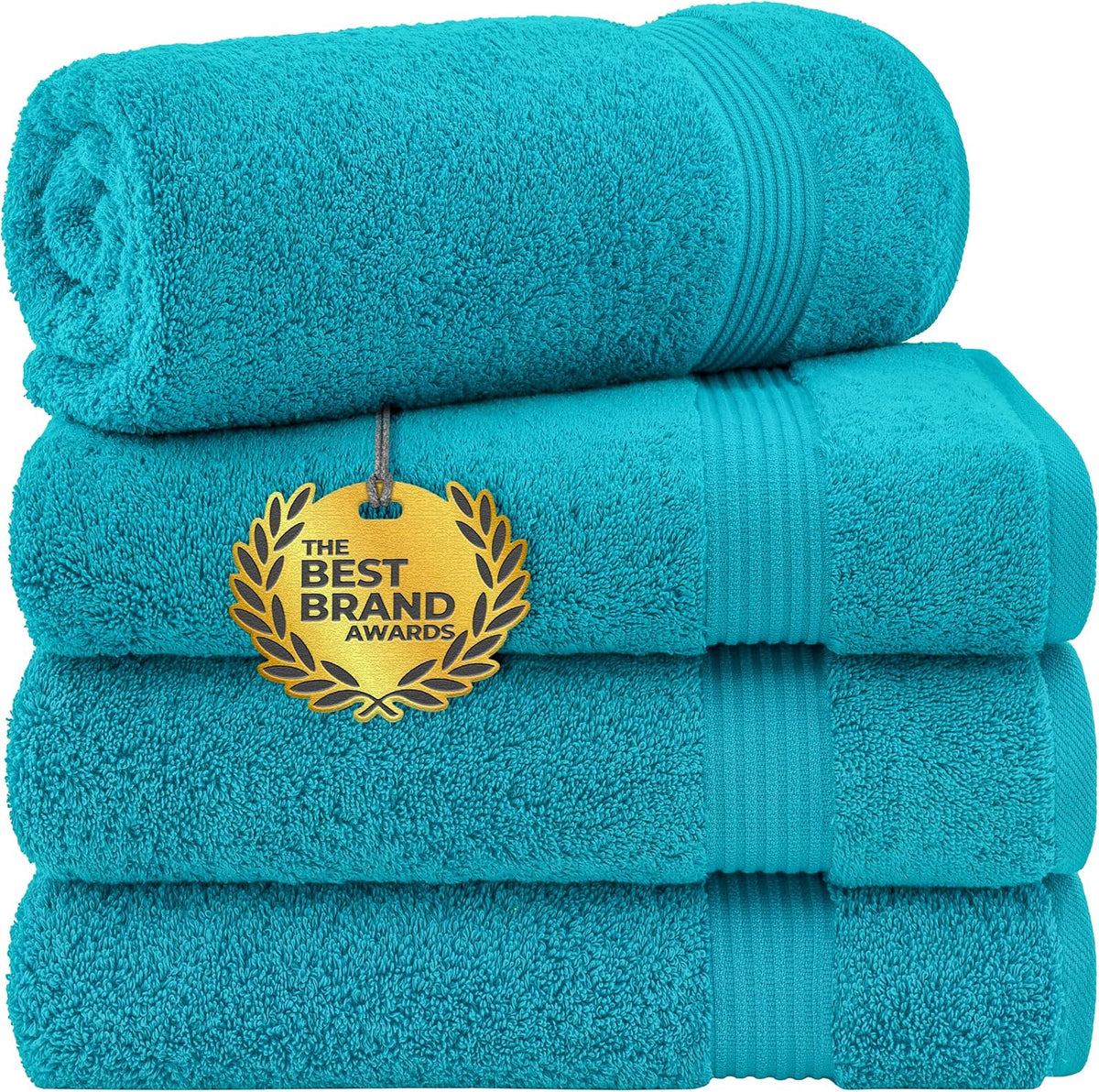 Close-up of a three-piece turquoise towel stack with one towel rolled on top
