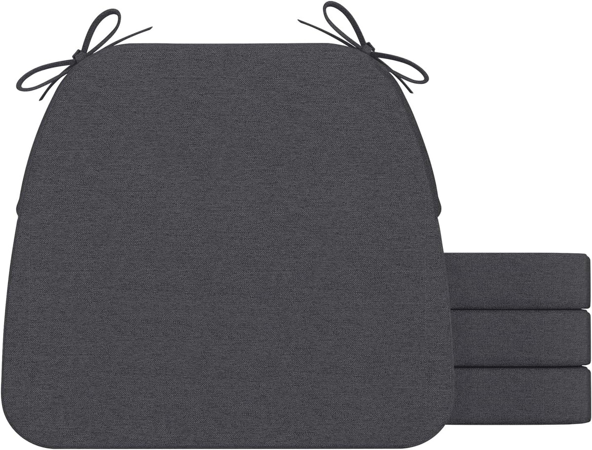 Front view of a single charcoal gray D-shaped chair cushion with tied corner straps and three matching cushions stacked