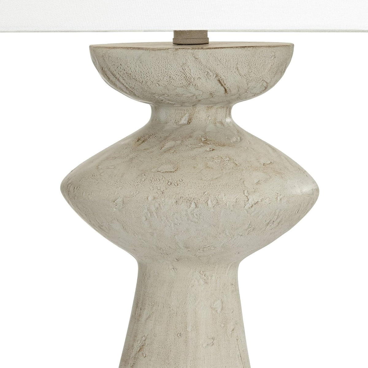 Close-up of the grey cast resin base showing the sculptural profile and lightly distressed texture