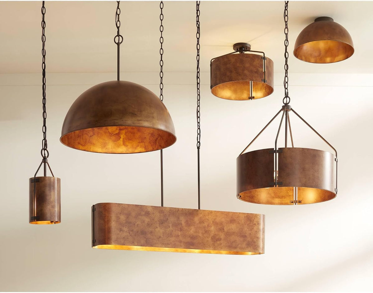 Ceiling scene showing multiple rustic bronze pendants including the 22" drum suspended among other fixtures