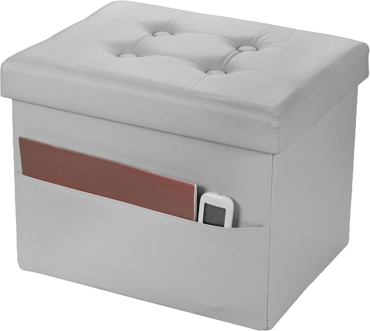 Light gray tufted faux-leather storage ottoman with front pocket holding a magazine and remote.