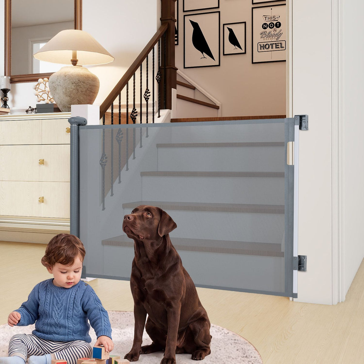 Gray retractable mesh gate spans a stairway opening behind a seated child and brown dog.