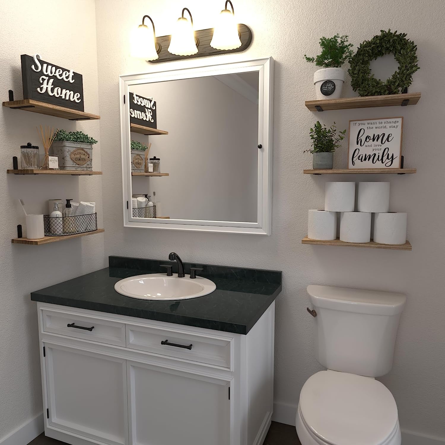 Rustic brown floating shelves installed around a bathroom mirror holding decor and toiletries above a vanity