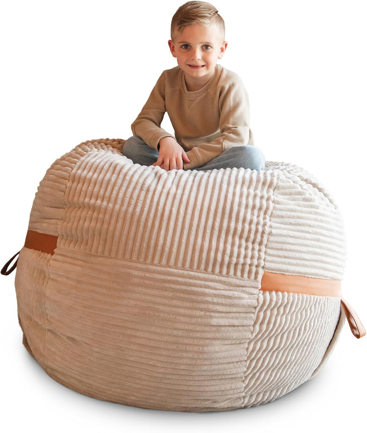 Front-close view of a beige ribbed lounger with a child seated on top, showing a leather side handle.