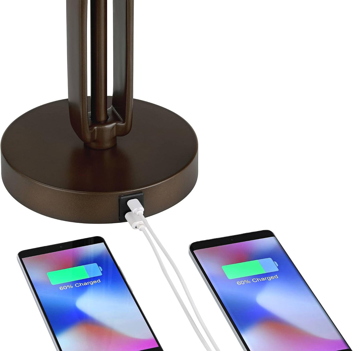 Round bronze base with USB-A and USB-C ports shown charging two phones on a table
